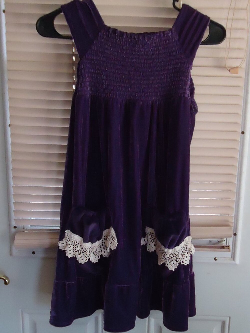 Smocked purple velvet pinafore with pockets